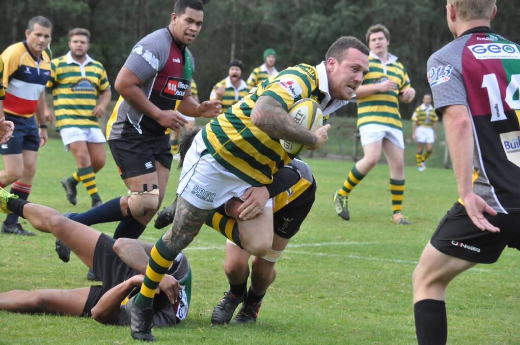TOUGH AS NAILS: Shoalhaven's James Mather in action against the Campbelltown Harlequins during the first grade Illawarra District Rugby Union clash at Rugby Park on Saturday. Photo: DAMIAN McGILL