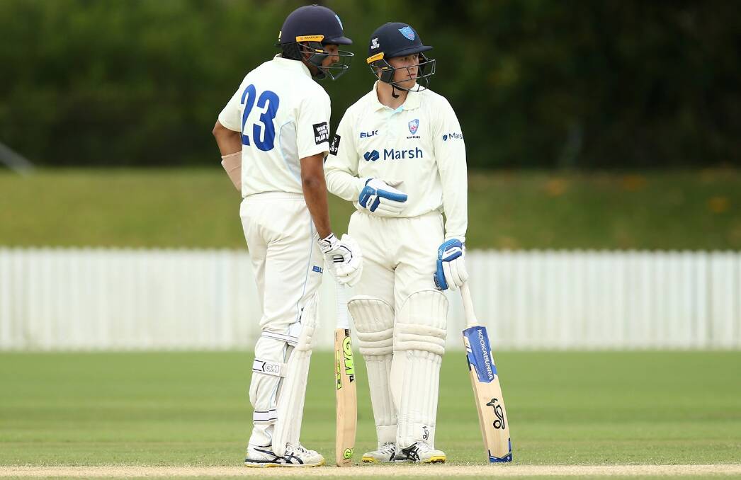 Ulladulla's Matthew Gilkes bat with Blues teammate Jason Sangha during the 2020-21 season. Photo: Cricket NSW