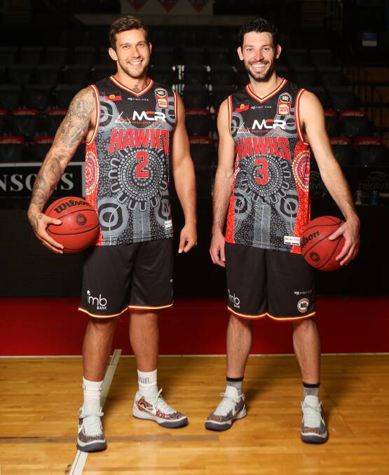 Tyson Demos and Kevin White in the Hawks NBL Indigenous jerseys. Photo: SYLVIA LIBER