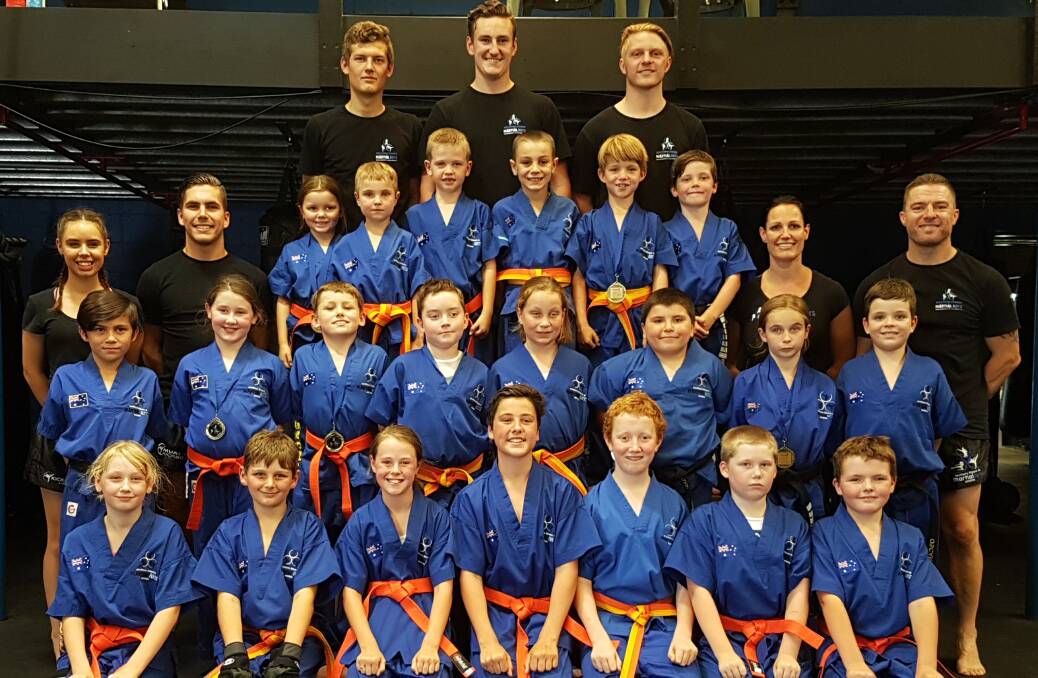 ALL SMILES: Southern Fitness and Martial Arts Centre Bomaderry's intermediate junior kick defence after their recent gradings.