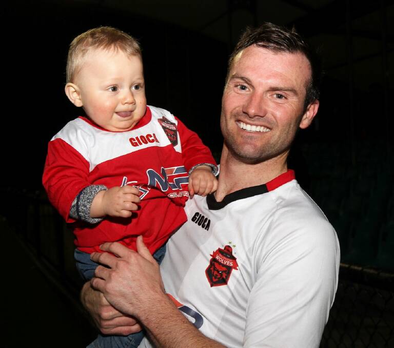 Chris Price and his son after their victory against Rockdale. Photo: PEDRO GARCIA PHOTOGRAPHY