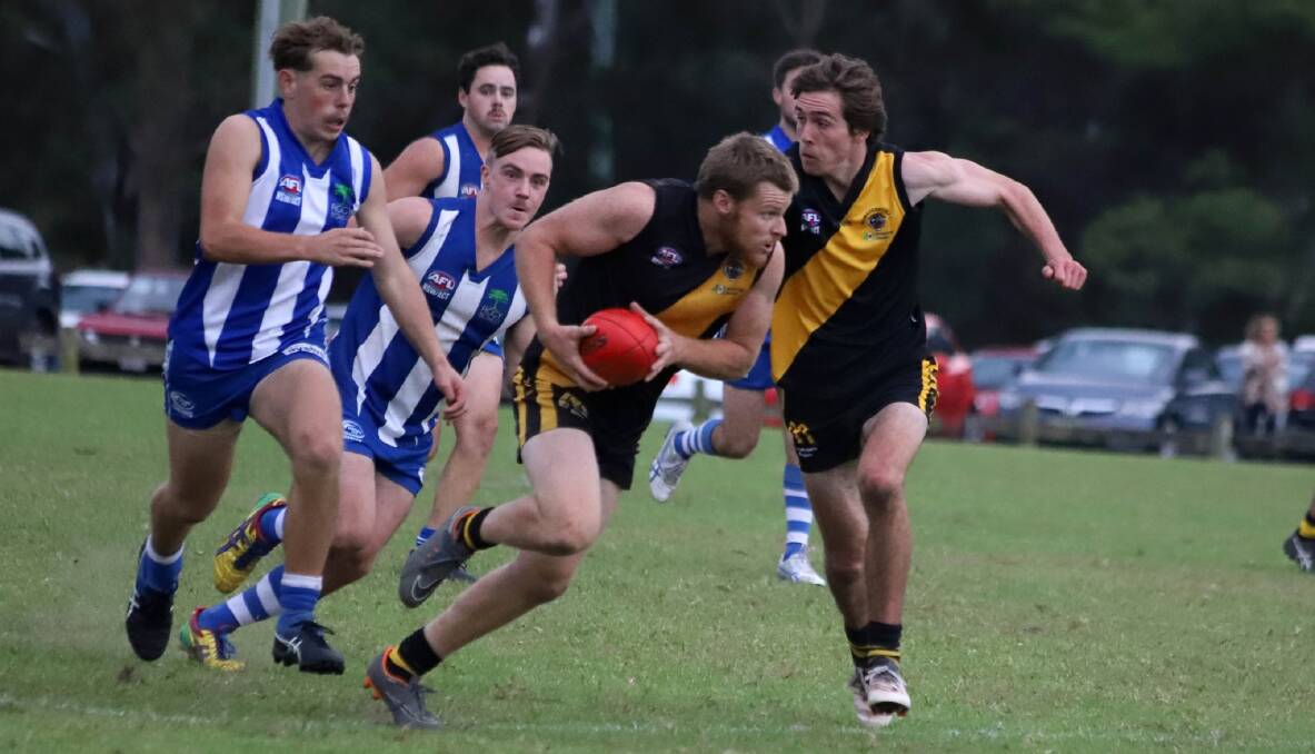 Bomaderry's Toby Craig runs the ball while team mate Charlie Rodden sets himself for a shepherd against Figtree earlier in the season. Photo: TEAM SHOT STUDIOS