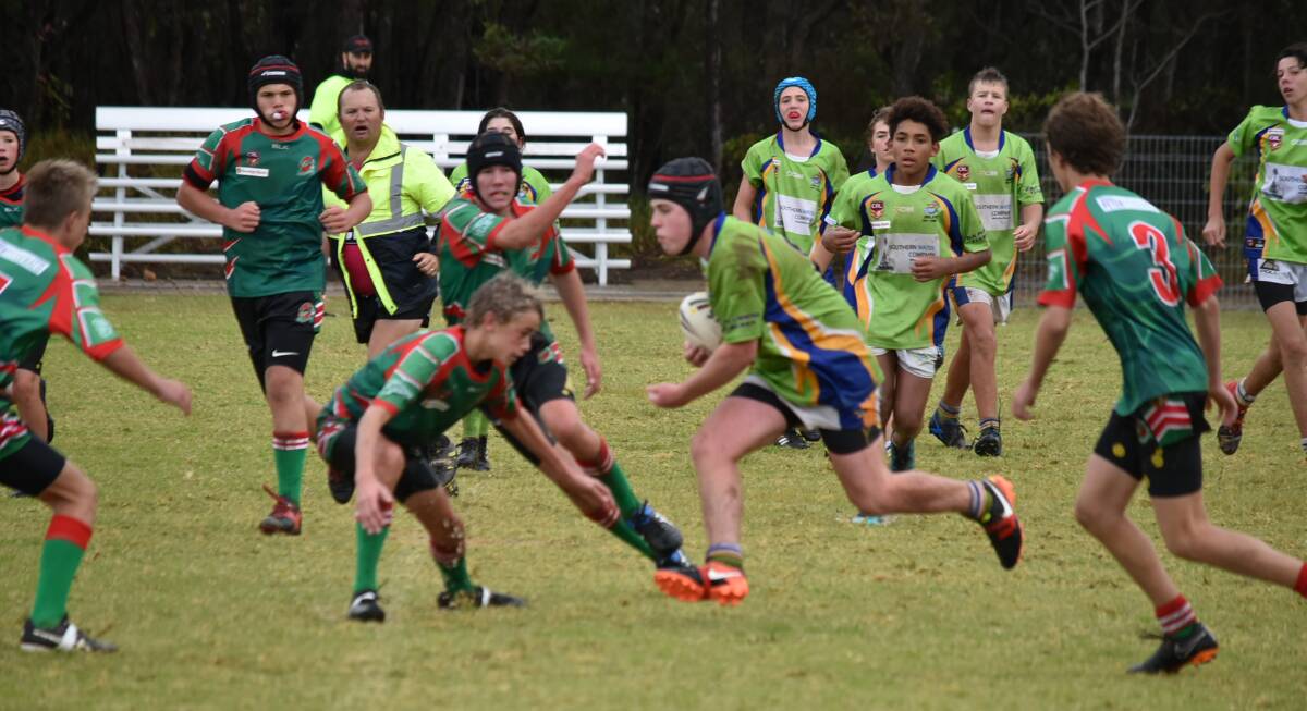 MOVING: Dolphins' Max Vukelic looks to find a gap in the defence. Picture: Jakki Haydock