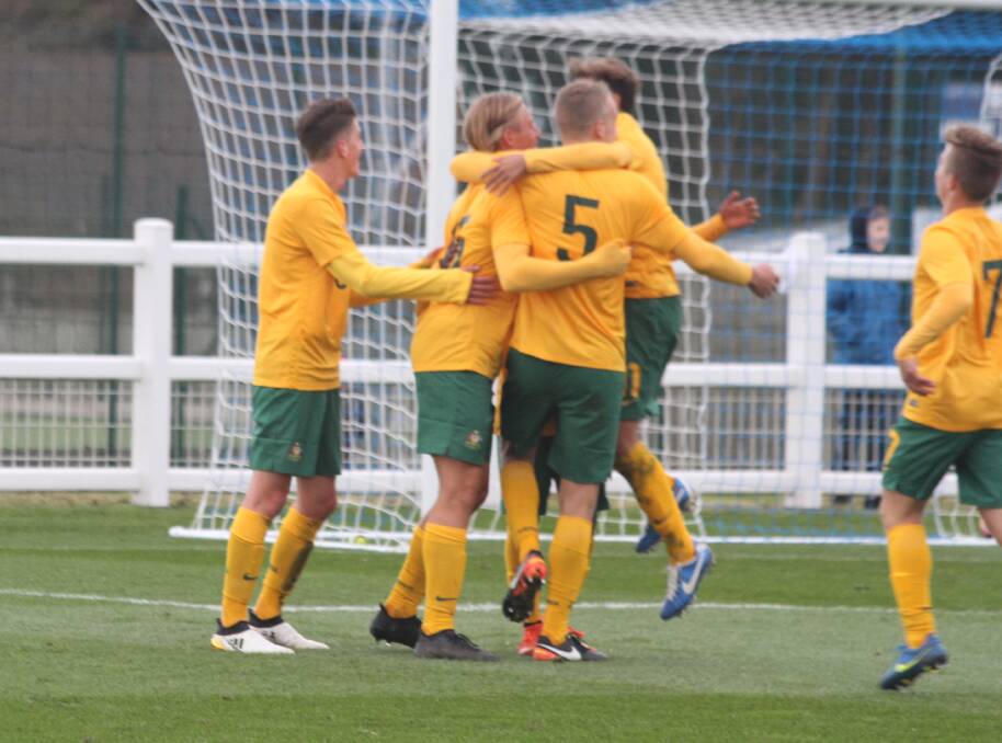 MASSIVE HONOUR: Jake Trew and his Australian Schoolboys team mates celebrate a goal during their recent tour of the United Kingdom.
