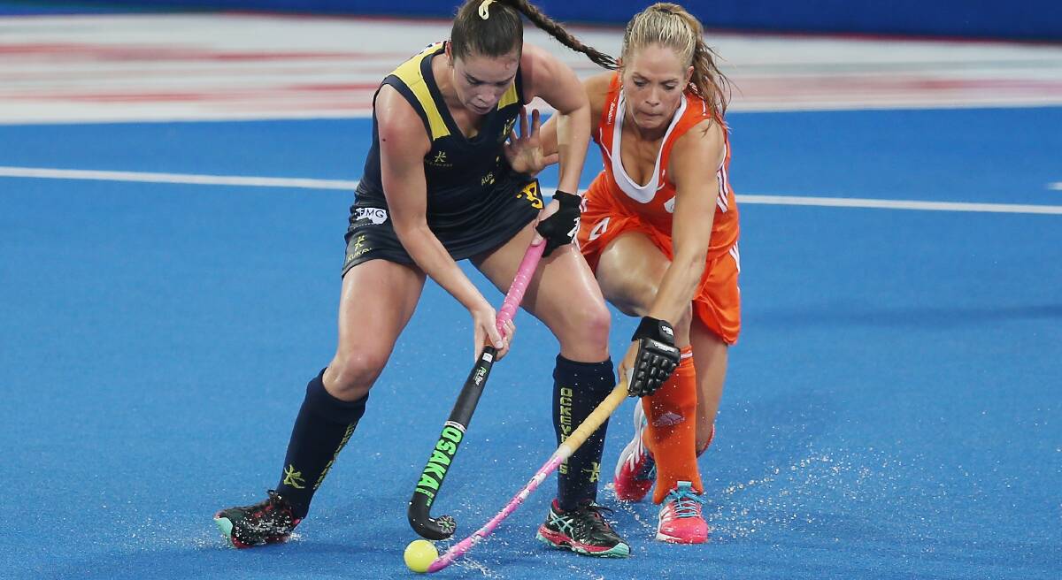 GOLDEN GIRL: Gerringong's Grace Stewart battles Kitty van Male (Netherlands) during the recent Champions Trophy. Photo: Alex Morton/Getty Images.