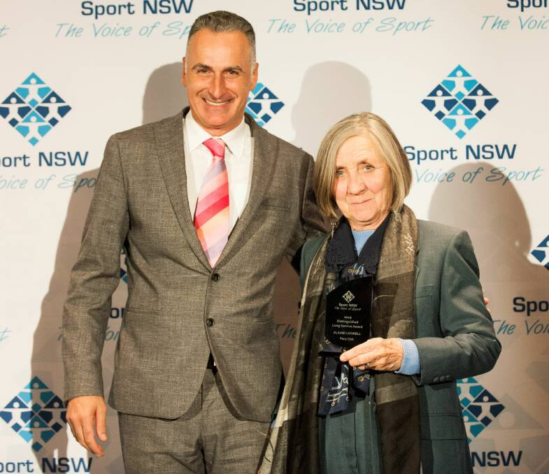WELL DESERVED: NSW minister of sport John Sidoti with Lake Conjola's Elaine Caswell at the NSW Community Sports Awards, held at NSW Parliament House. Photo: DIANNE ENGESSER