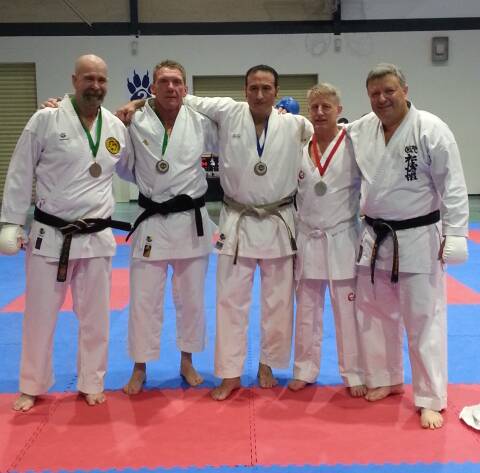 Best of the best: David Rush (second from right) takes his spot among the medallists at the Shotokan Karate International Australia National Championships last weekend in Queensland.