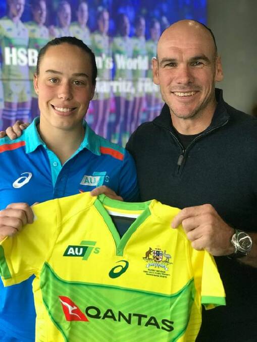 Rhiannon Byers being presented her debut Australian jersey by Nathan Gray. Photo: AU 7s