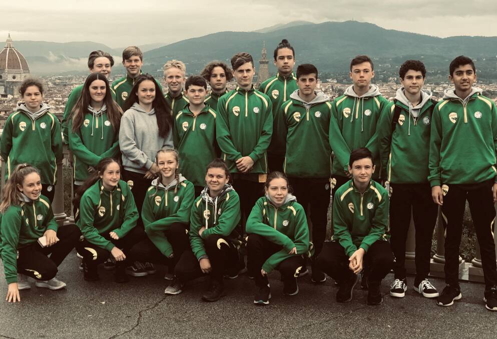 Michael Attard (back row, third from left), Kai Bowman (centre) and their Australian futsal squad, with their girl counterparts, in Italy.
