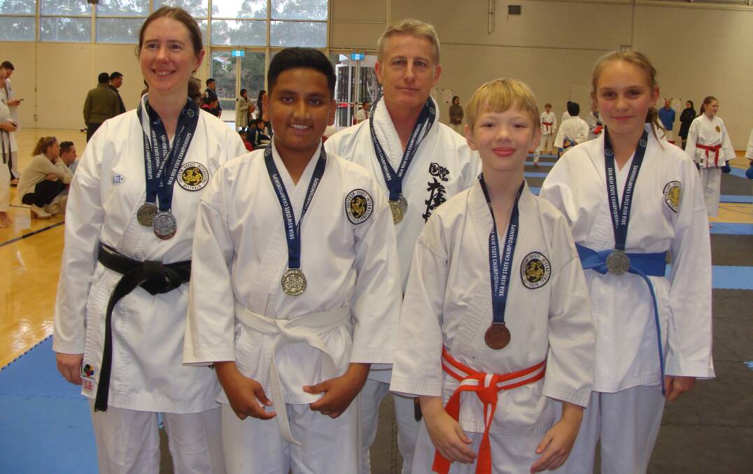 Success: The South Coast Shotokan Karate team at SKIA NSW State Tournament (l to r) Amanda, Edward, David, Jay and Evie.