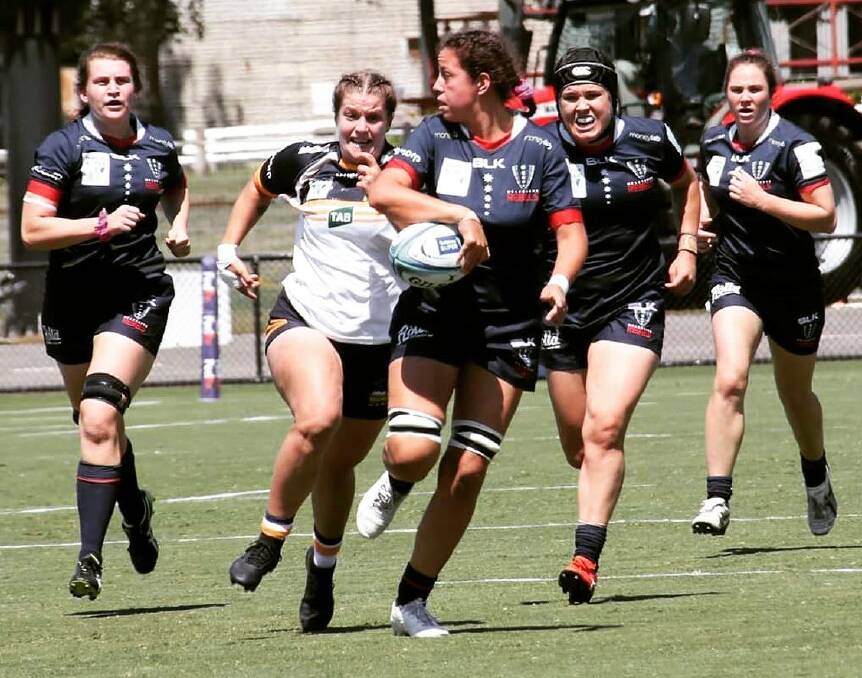 ACT's Harriet Elleman chases down a Melbourne Rebels opponent on Saturday. Photo: BRUMBIES MEDIA