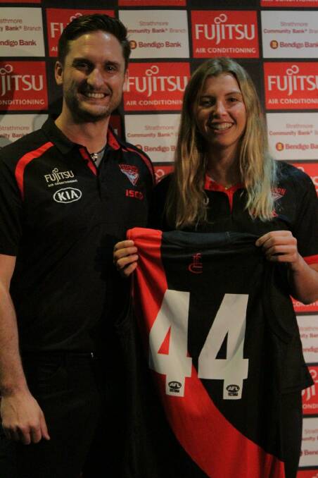 Essendon VFL women's coach Brendan Major and Maddy Collier at the club's jersey presentation. Photo: BOMBERS MEDIA