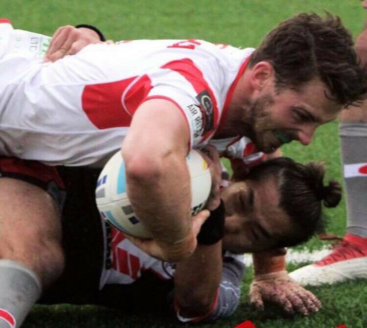 Michal Maslanka dives over to score one of his two tries against Japan on Sunday. Photo: POLAND RL
