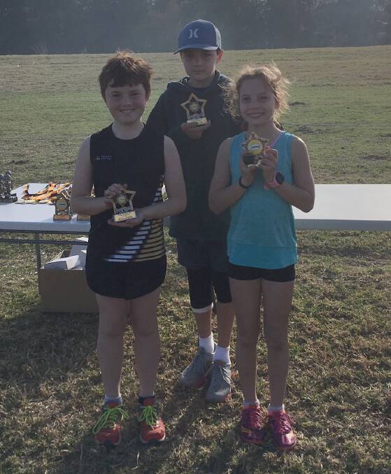 GOING FOR GOLD: 3km Division 1 trophies went to William Anderson, Hamish McLaren and Emily McLaren.