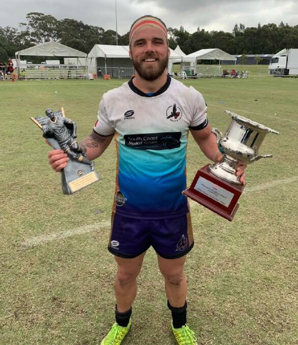 Ryan James shows off his silverware after the South Coast Black Cockatoos 2019 Koori Knockout victory. Photo: Supplied