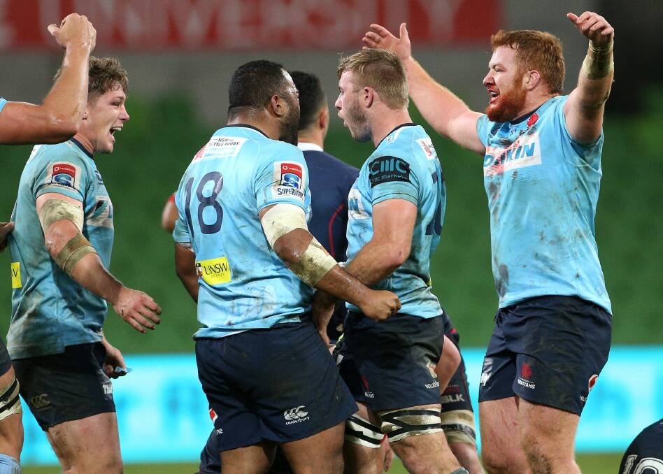 Will Miller (second from right) and his Waratahs team mates celebrate their win. Photo: Hamish Blair