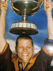 Shellharbour's Cole Skelly with the 2001 premiership trophy. Photo: Supplied