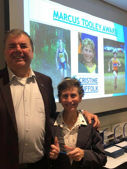 AWARD: Athletics NSW president Peter Higgins with Cristine Sufflok.