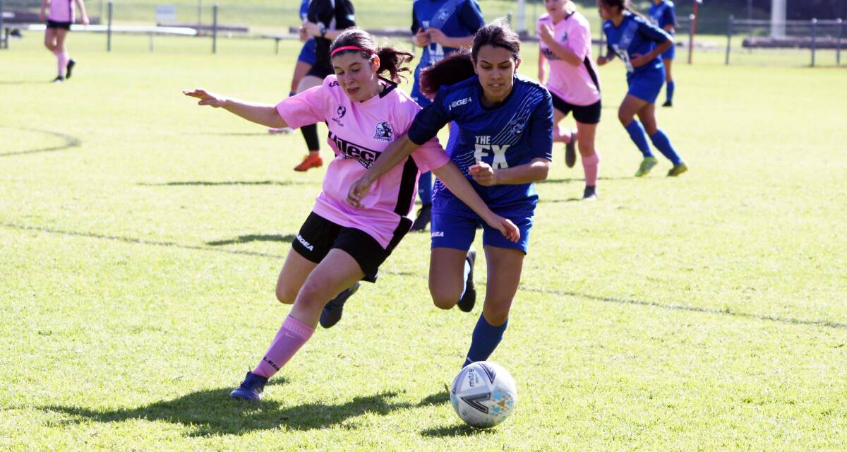 Southern Branch under 17s player Ella Simon battles a St George opponent for possession. Photo: Freddie Simon
