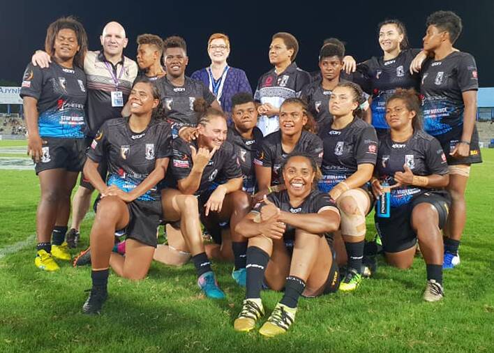 CJ Sims (back row, second from right) and her Fiji Bulikula side after the match. Photo: Fiji National Rugby League Limited