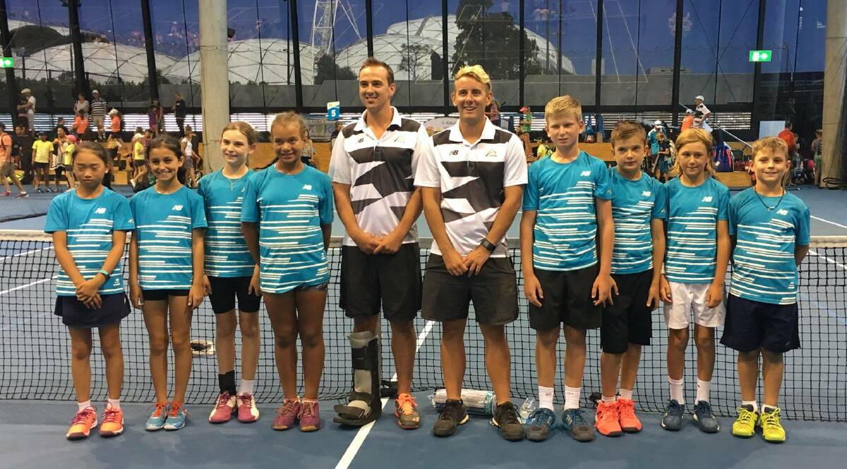 STRENGTH IN NUMBERS: Pritchard Tennis Academy’s Boyd Schreiber (far right) with NSW 10s team with girls and managers at Melbourne Park. 