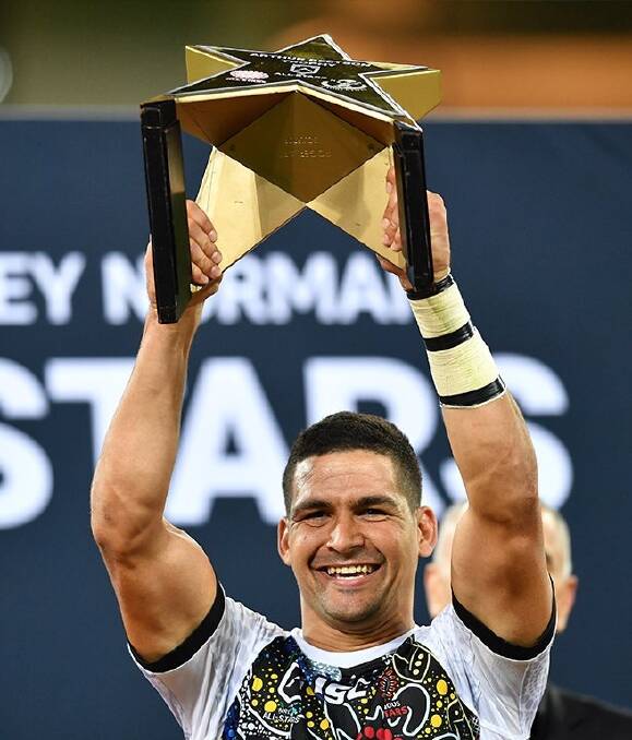Indigenous caption Cody Walker with the All Stars trophy. Photo: NRL PHOTOS