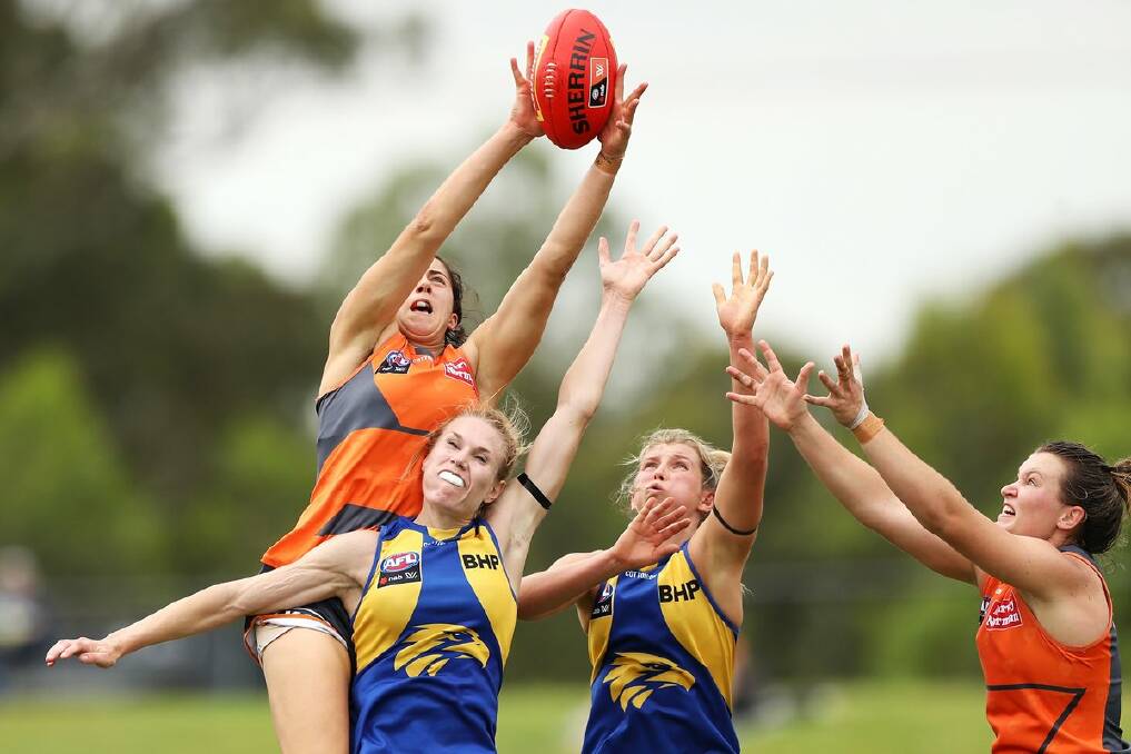 West Coast's Maddy Collier (second from right) attempts to win possession for her team against the GWS Giants. Photo: EAGLES MEDIA