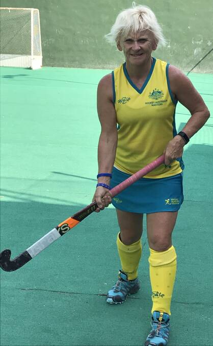 GOLDEN GIRL: Barbara Muldoon received her Australian Wattles team's coaches award after helping the side claim fourth spot at the Masters World Cup.