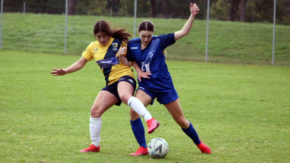 Southern Branch's Mackenzie Simpson (right) tries to win possession against her North Shore Mariners under 17s opponent. Photo: Freddie Simon