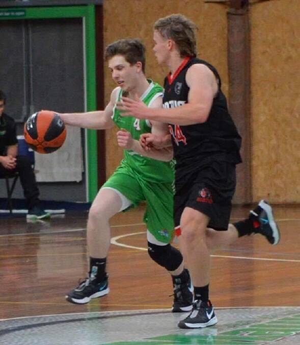 Magic's Josh Watts pushes the ball up the court against Norths. Photo: Roz Wellington