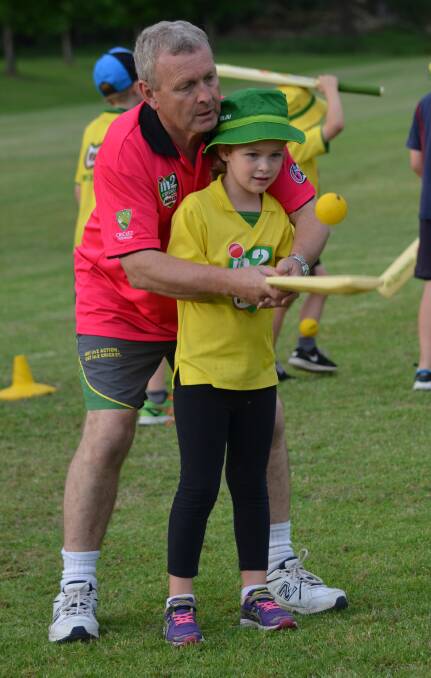  Girls just wanna have fun: Young Tahlia McVey works on her hand-eye co-ordination skills with coach Tim Bricklebank.
