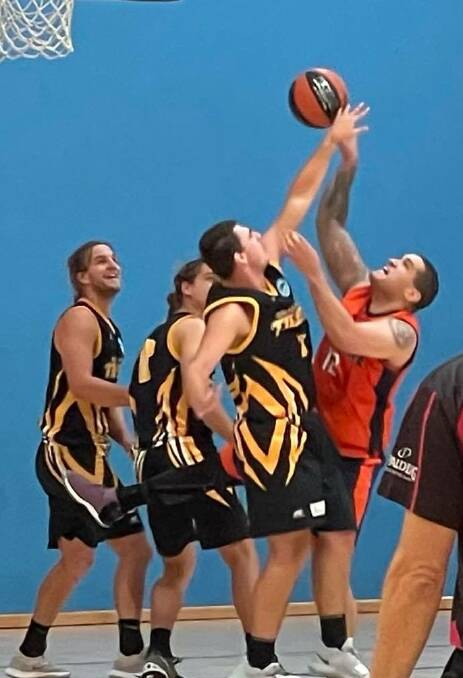 Shoalhaven's Tom Ozolins, Bruce Ozolins and Jeremy Harding play defence against Camden Valley Wildfire on Saturday. Photo: Carolyn Harding