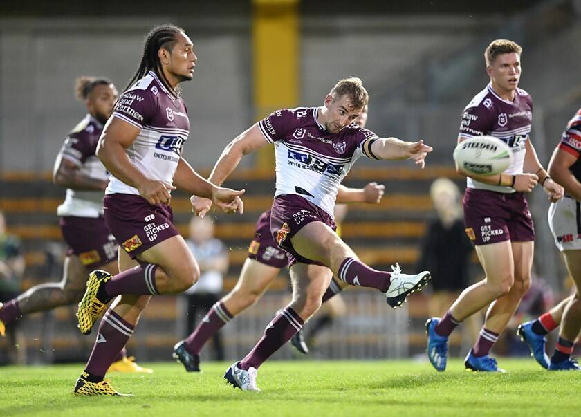 Reuben Garrick (right) watches on as teammate Lachlan Croker puts a kick through against the Roosters. Photo: SEA EAGLES MEDIA