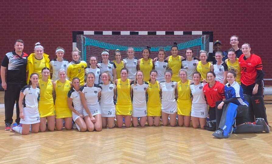 The Australian and Austrian indoor women's hockey teams after their match.