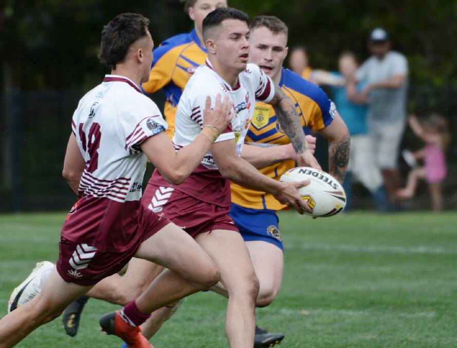 Albion Park-Oak Flats' Kane Ball looks for a pass during the 2019 under 18s grand final against Warilla-Lake South. Photo: GREG RIGBY