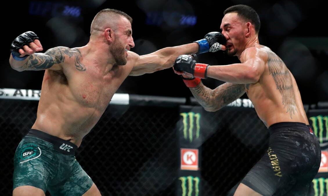 Alex Volkanovski (left), in action against Max Holloway, is the most underrated UFC world champion, says NZ's Israel Adesanya. Photo: UFC