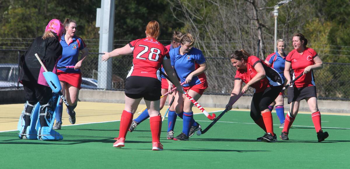 ATTACK: St Georges Basin's Jenny Moffatt takes on the Burrawang defence in the women's minor semi-final on Saturday. Photo: ROBERT CRAWFORD
