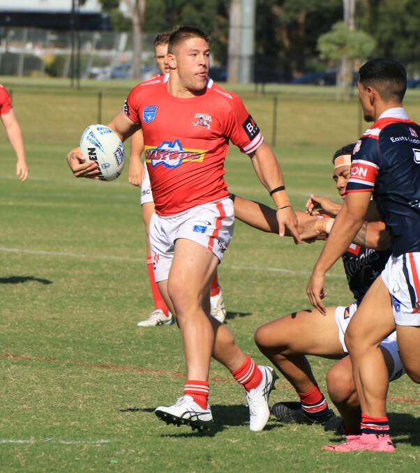 Albion Park-Oak Flats' Josh Coric makes a break for the Steelers against the Roosters on Saturday. Photo: Allan Barry