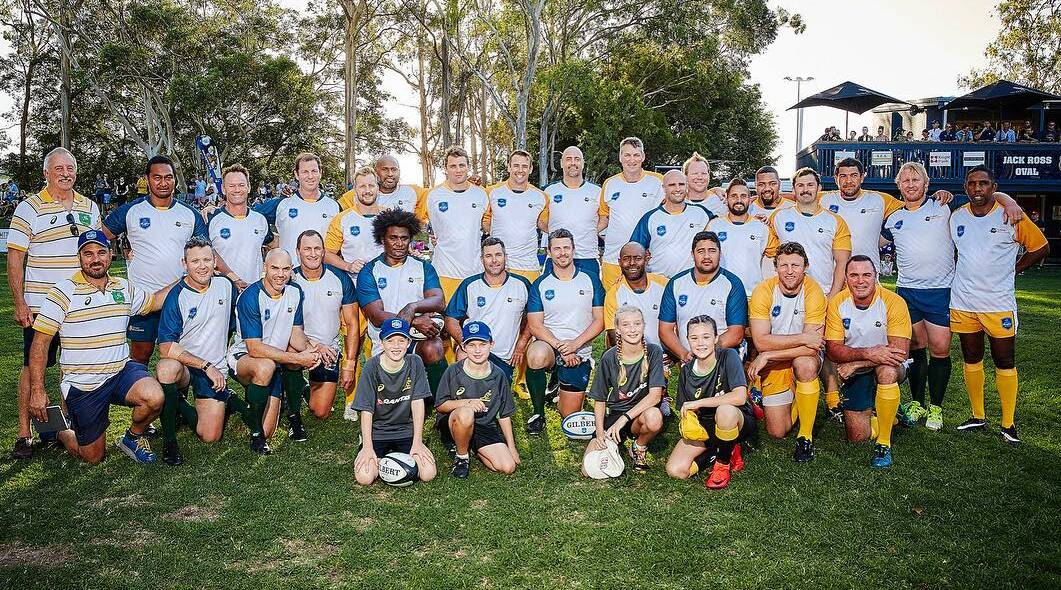 Michael Hayes (front row, far right) and the two Classic Wallabies teams on Saturday.