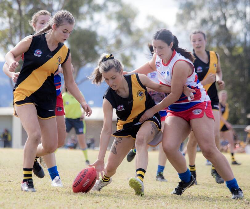 Tigers' Lily Macdonald and Jaimi-Lee Gibbs contest the footy on Saturday's game with Bulldogs. Photo: TEAM SHOT STUDIOS