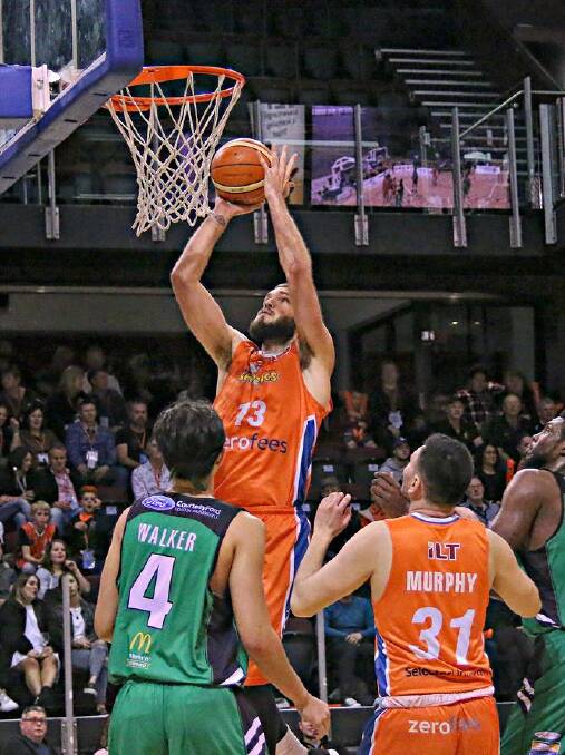 James Hunter does a lay-up for the Sharks against the Jets. Photo: MONCIA TORRETO