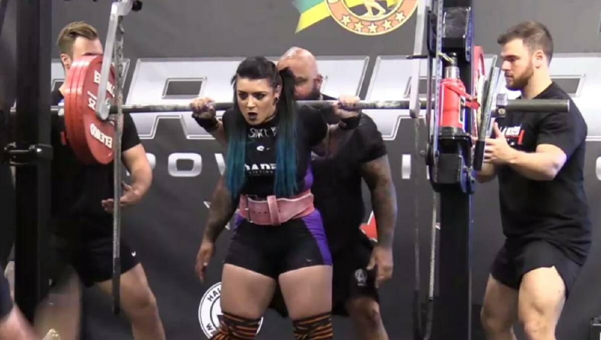CONCENTRATION: Nowra's Jaymii Morris sets herself during one of her squats at the weekend's Pro Raw Nine at the Arnolds in Melbourne.