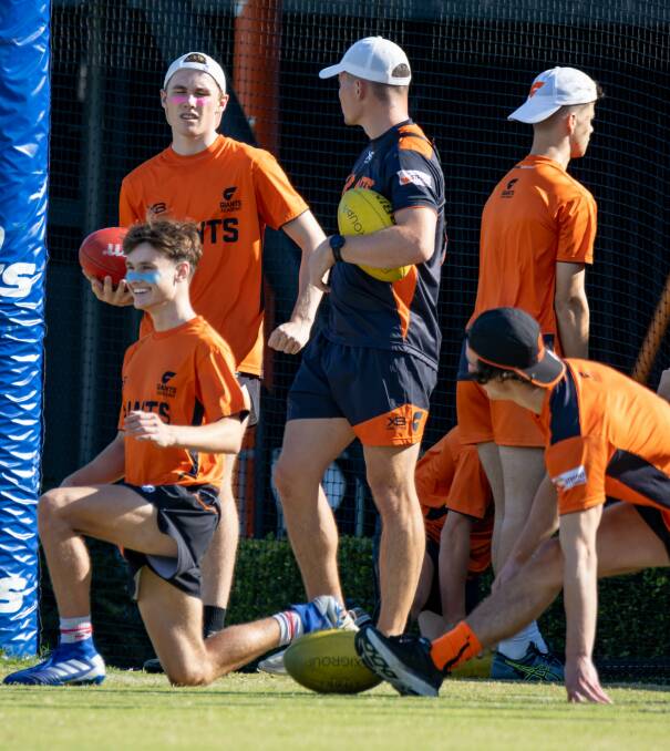 Giants Academy players warm-up and stretch prior to a recent session. Photo: Giants Media
