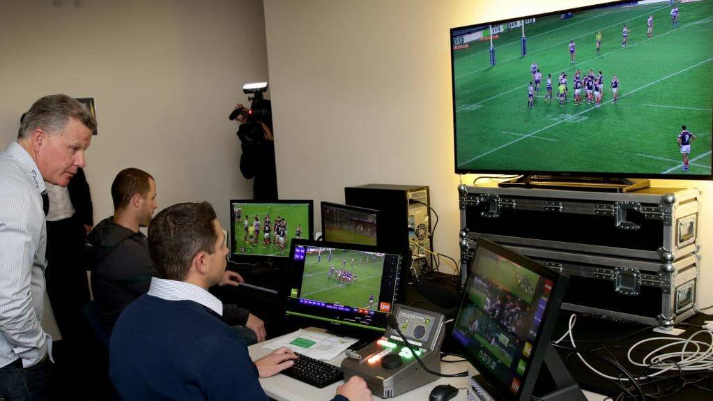Luke Patten (middle) during his stint in the NRL Bunker. Photo: NRL PHOTOS