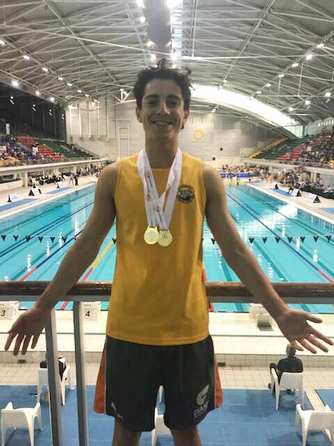 STOKED: Cambewarra's Jack Batson with two of his state gold medals.