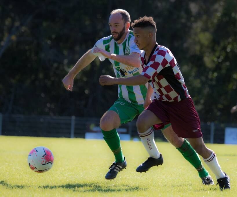 Huskisson-Vincentia's Jeremy Smith and Callala's Myron Kennedy battle for possession on Saturday. Photo: Team Shot Studios