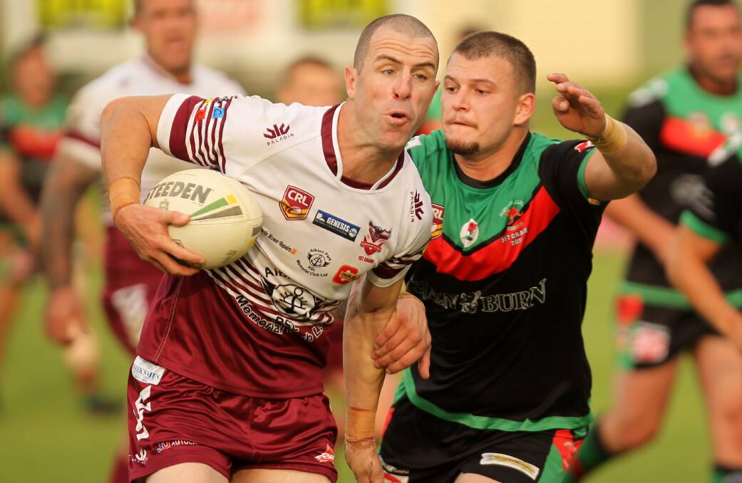 Eagles' Luke Patten and Superoos' Corey Grigg. Photo: DAVID HALL
