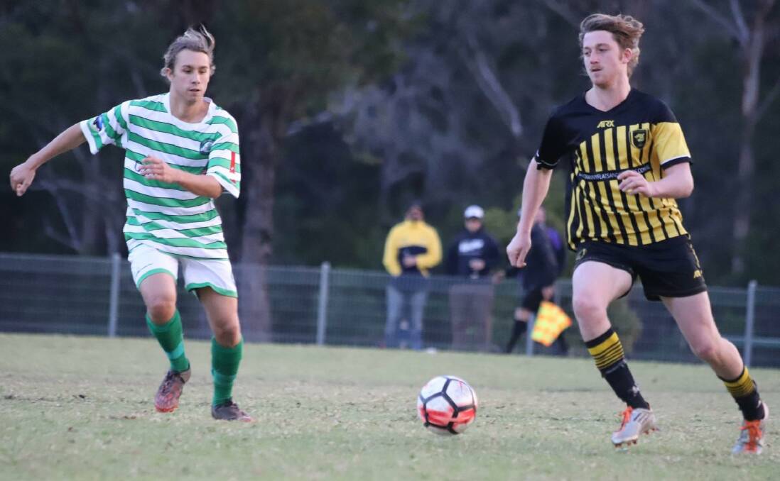 EYES ON THE PRIZE: Seagulls' Riley Barry and Tigers' Jordan Haddow contest possession in Saturday's match at Huskisson. Photo: TEAM SHOT STUDIOS