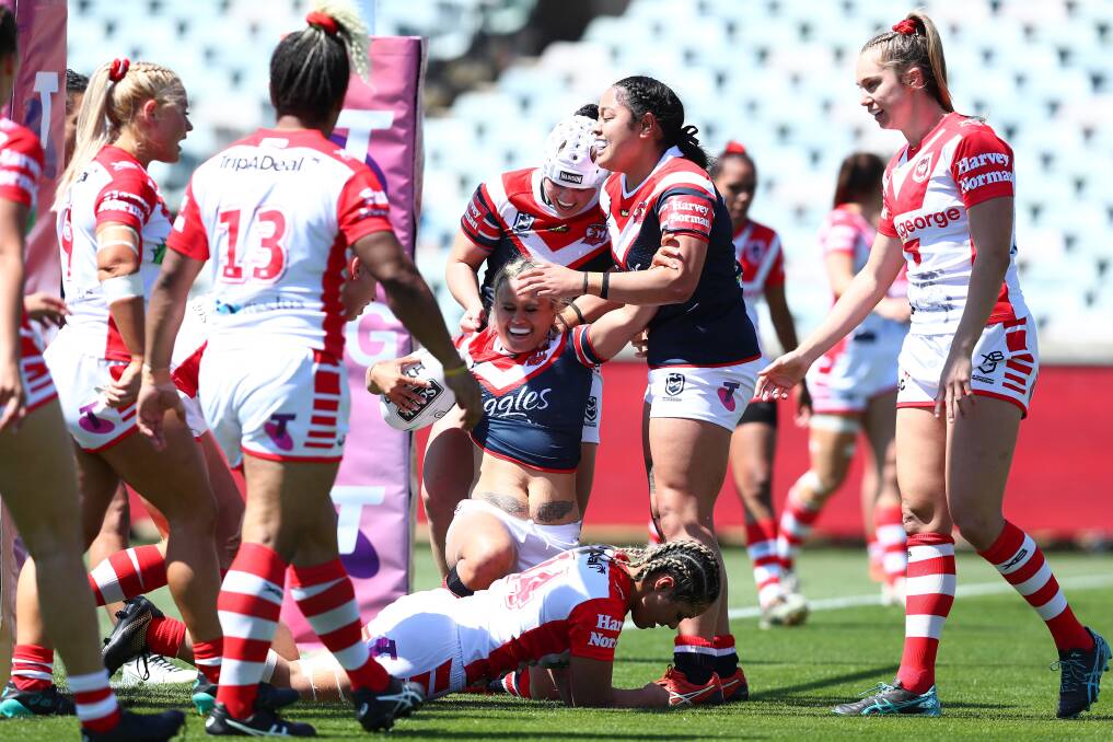 South Coast's Kezie Apps (right) and her Dragons side concede a try on Saturday. Photo: NRL Imagery/Keegan Carroll.