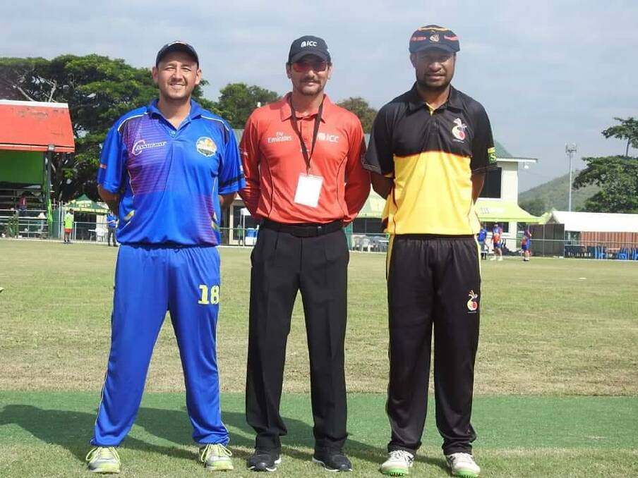 Jonathan Hill with the match umpire and PNG skipper Assadollah Vala.